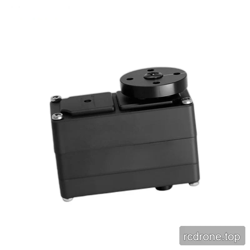 Horizontal black servo showing its broad casing side, casing seams, and circular output plate at the upper right.