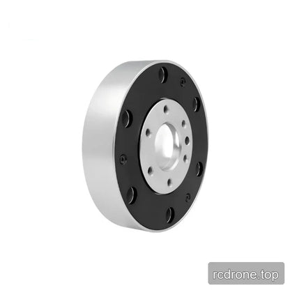 Upright circular sensor with the silver sidewall exposed on the left, a black mounting face, and a recessed silver center.