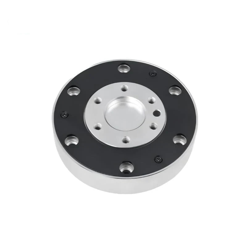 Circular KWR116 sensor viewed from above, with a black outer face, silver recessed center, and mounting holes.