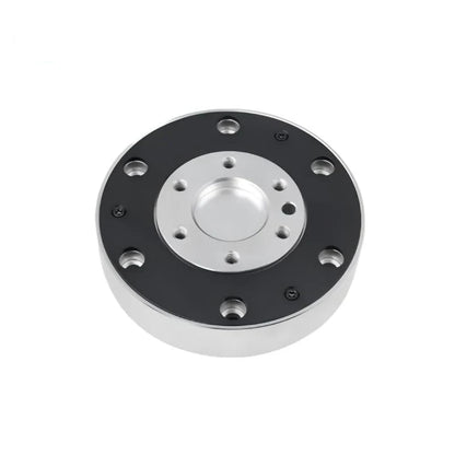 Circular KWR116 sensor viewed from above, with a black outer face, silver recessed center, and mounting holes.