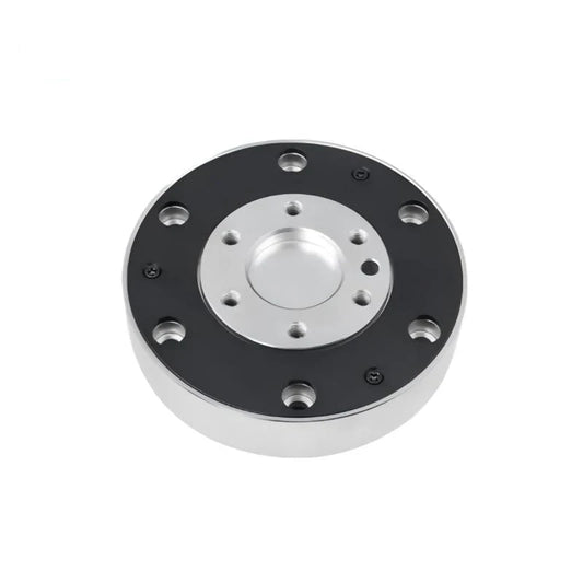 Circular KWR116 sensor viewed from above, with a black outer face, silver recessed center, and mounting holes.