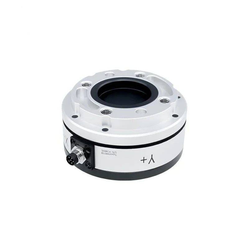 Angled top view of the sensor showing a recessed black center, silver mounting face and lower-left connector.