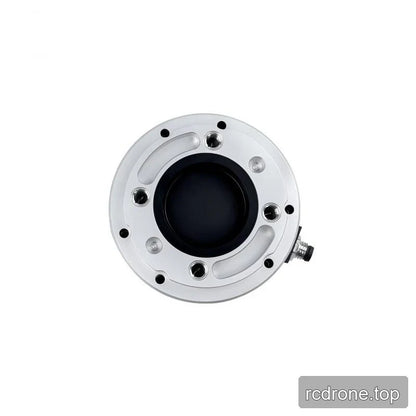 Overhead view of the silver sensor face with curved recesses, threaded holes, black center and right-side connector.