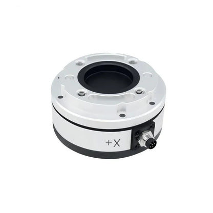 Silver circular sensor viewed from above, showing recessed center, threaded mounting holes, +X marking, and right-side connector.