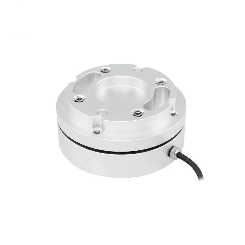 Circular silver sensor with a stepped mounting face, black housing seam, and side cable curving down to the right.