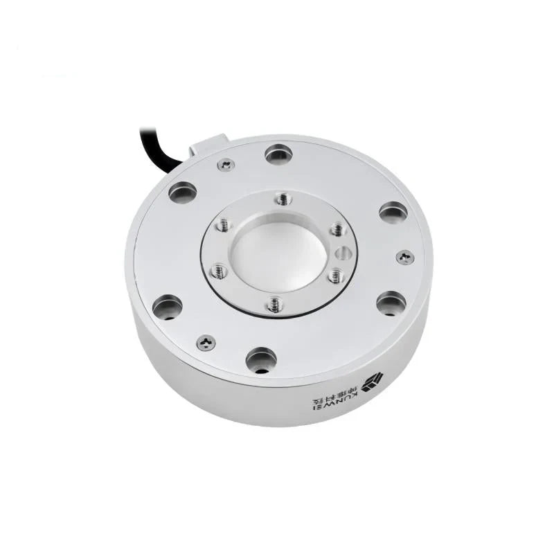 Circular silver sensor viewed from above, showing threaded inner holes, outer mounting holes, and branding on the sidewall.