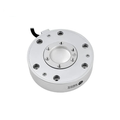 Circular silver sensor viewed from above, showing threaded inner holes, outer mounting holes, and branding on the sidewall.
