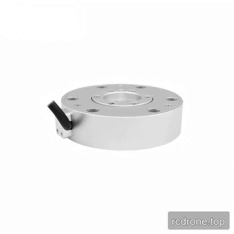 Low-angle view of the silver sensor showing its cylindrical sidewall and black cable exiting the left-side mounting block.