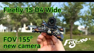 Flywoo Firefly 1S O4 Wide nano drone held in hand with forward camera; on-image text notes 155° FOV