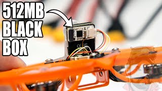 Flywoo 512MB black box nano module mounted on a drone frame with wiring harness and connector