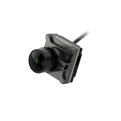 Walksnail Avatar HD Nano FPV Camera in gray housing, angled view with wide lens and cable