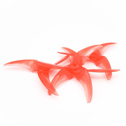 Two stacked translucent red tri-blade propellers showing blade curve and hub profile on white