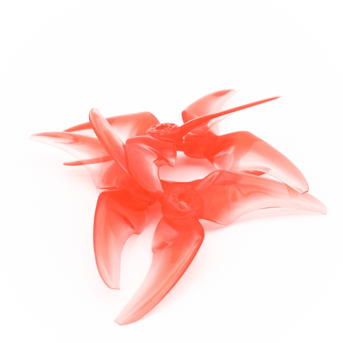 Two translucent red 3-blade FPV propellers stacked together, CW/CCW pair view