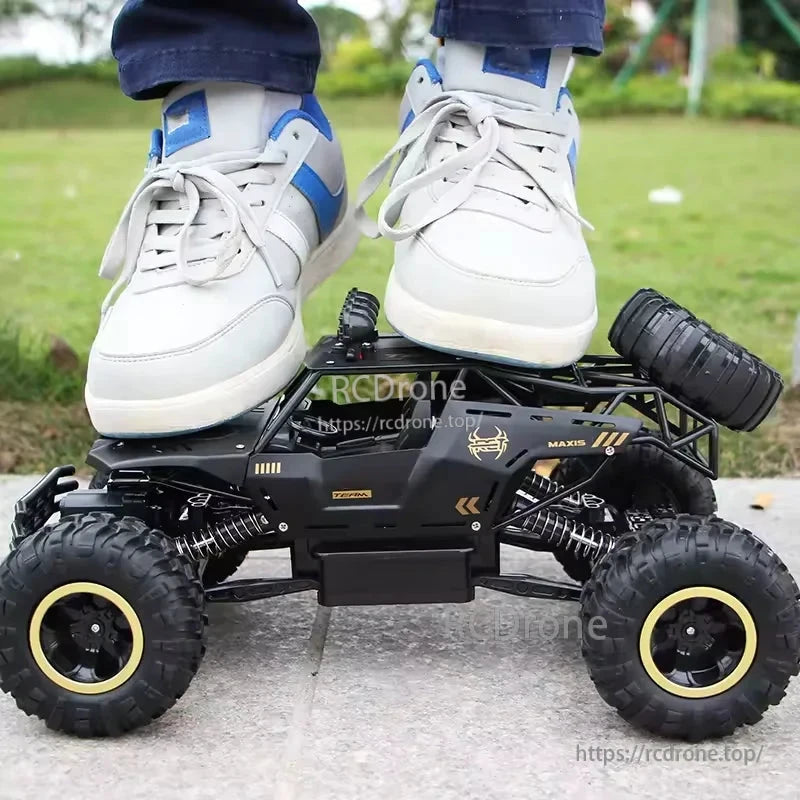 RC Off-Road Truck 1/12 4WD Alloy Climbing Car, A 1/12 scale 4WD RC off-road truck with dual motors, alloy chassis, 2.4GHz remote, 20km/h speed, and 45° climbing capability.