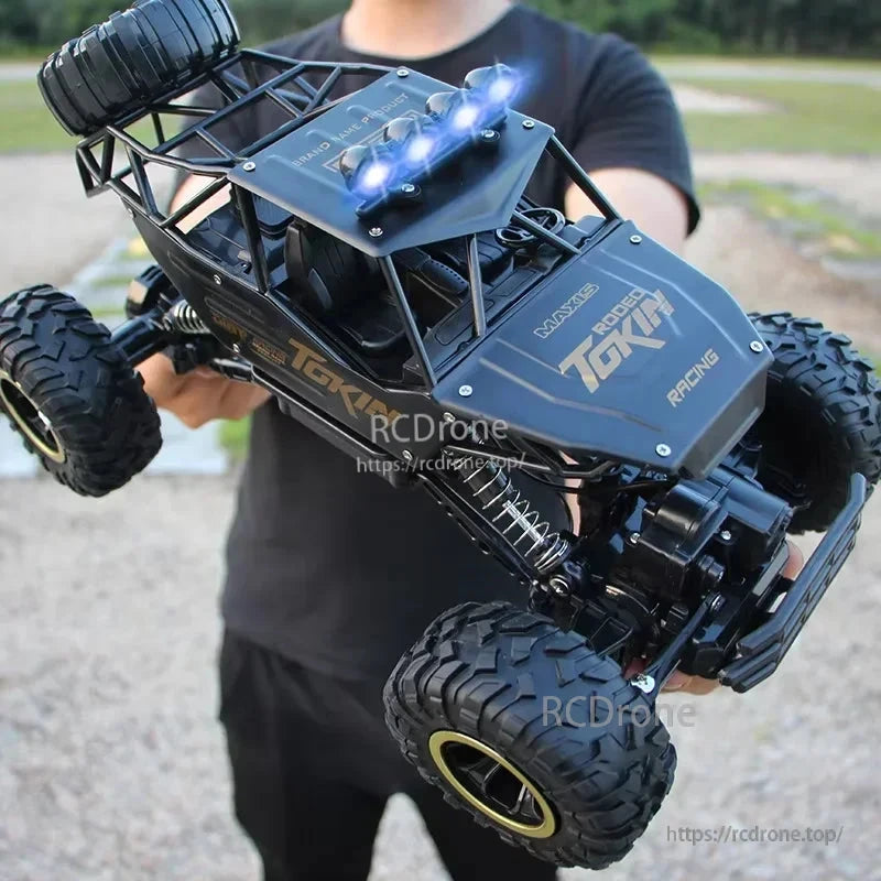 RC Off-Road Truck 1/12 4WD Alloy Climbing Car, A 1/12 scale 4WD RC off-road truck with alloy chassis, dual motors, and 2.4GHz remote control for climbing and rugged terrain.