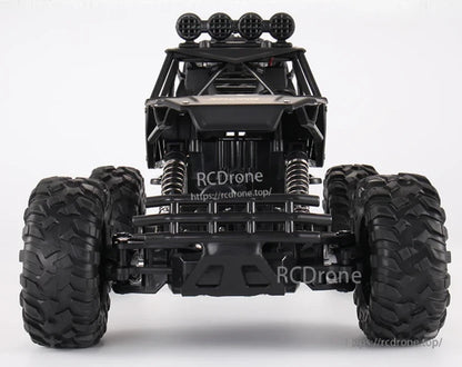 RC Off-Road Truck 1/12 4WD Alloy Climbing Car, 1/12 scale 4WD alloy off-road truck with dual motors, 2.4GHz remote, 20Km/h speed, and 45° climbing ability.