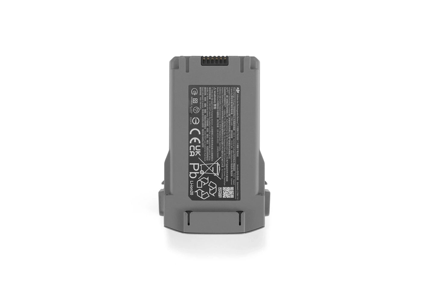 DJI Mini 5 Pro Intelligent Flight Battery, Gray DJI Mini intelligent flight battery with top contact pins and safety label on the back