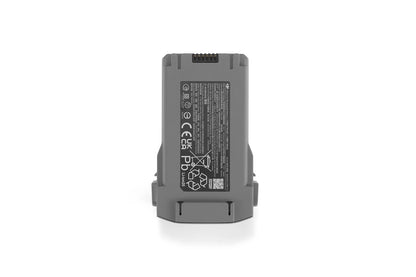 DJI Mini 5 Pro Intelligent Flight Battery, Gray DJI Mini intelligent flight battery with top contact pins and safety label on the back