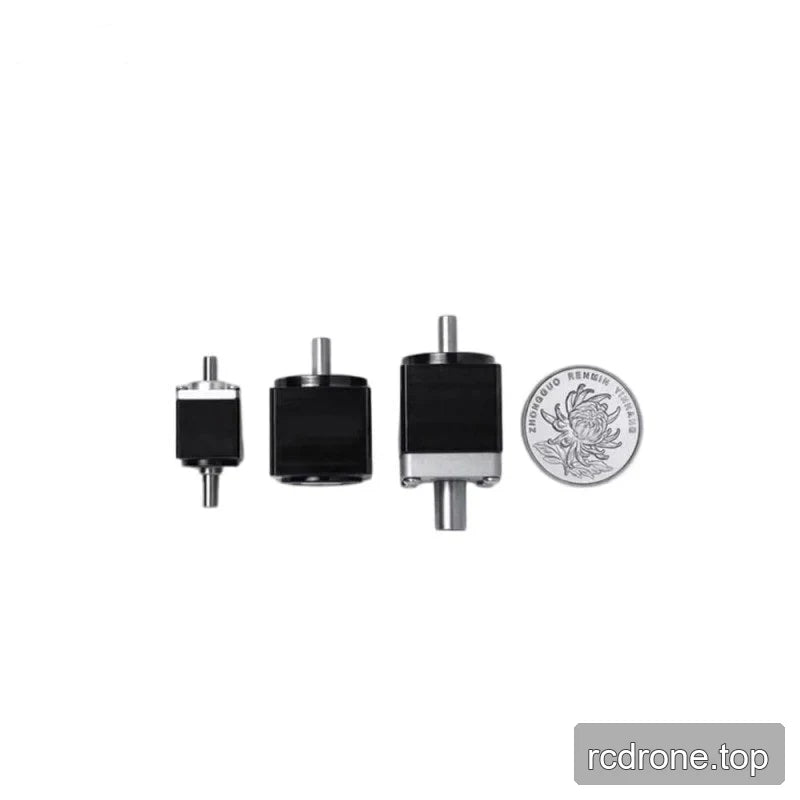 Three compact black shaft reducers shown beside a Chinese 1 yuan coin for relative size comparison.