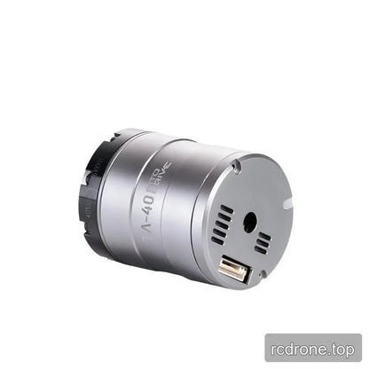 Horizontal view of the silver TA-40 actuator showing its circular connector end, vent slots, central opening, and black ring.