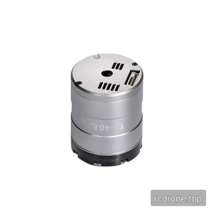 Rear three-quarter view of the TA-40 rotary actuator showing the end face, vent slots, central opening, and connector.