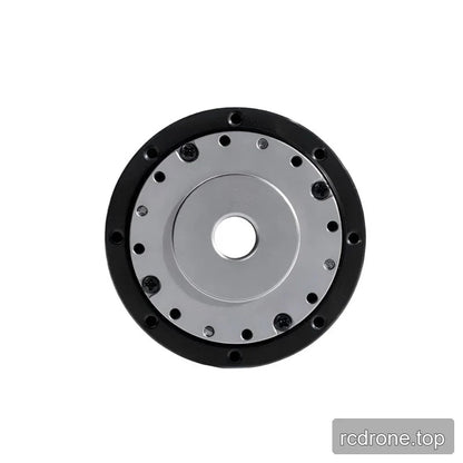 End-on view of the TA-52 actuator showing a circular silver mounting plate, central bore, bolts, and black outer ring.