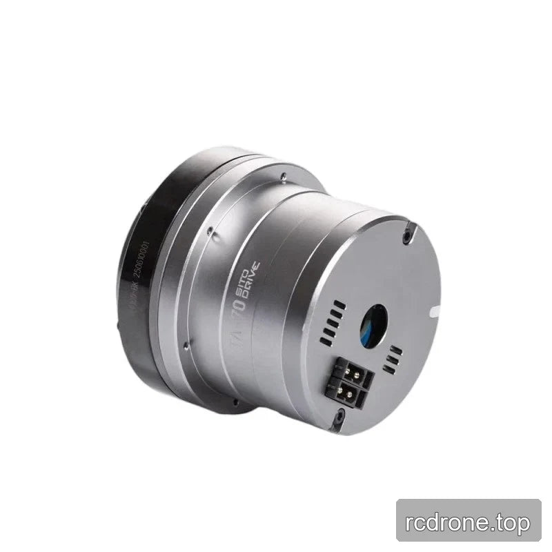 Angled rear view of the TA-70 rotary actuator with end plate, central opening, vent slots, and connector visible.