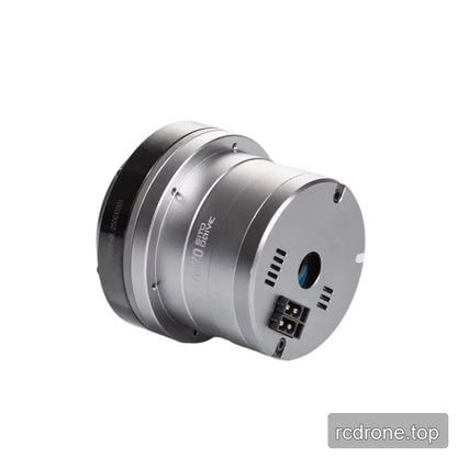 Angled rear view of the TA-70 rotary actuator with end plate, central opening, vent slots, and connector visible.