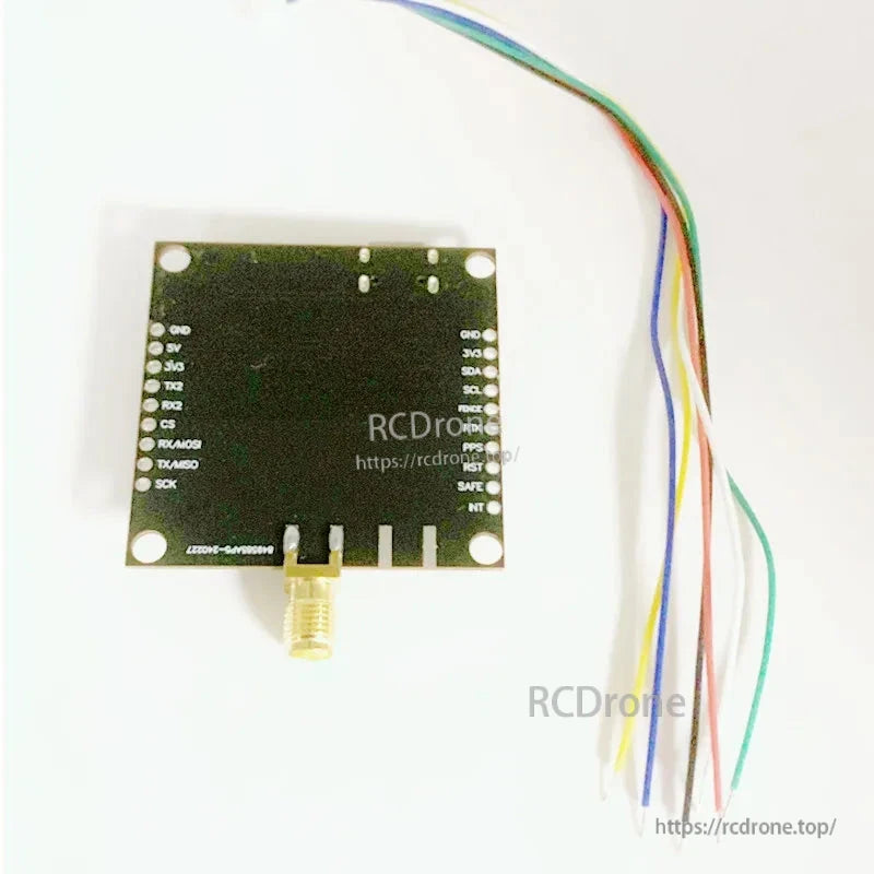 u-blox ZED-F9P GNSS RTK board with SMA antenna connector, labeled UART/I2C/SPI pins and wire harness