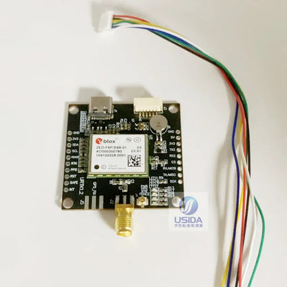 u-blox ZED-F9P GNSS RTK board with USB-C port, SMA antenna connector, and multicolor wiring harness