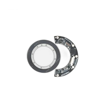 ZeroErr eCoder35H magnetic encoder shown separated into a circular magnetic ring and semicircular circuit board.