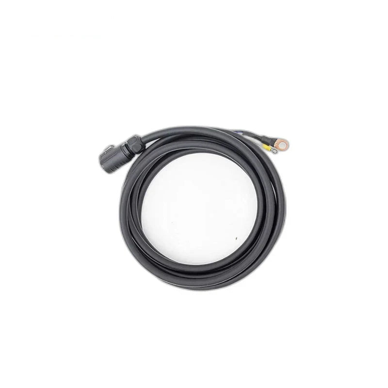 Coiled black ZeroErr eLine cable with a circular connector and two visible ring-terminal wire leads.