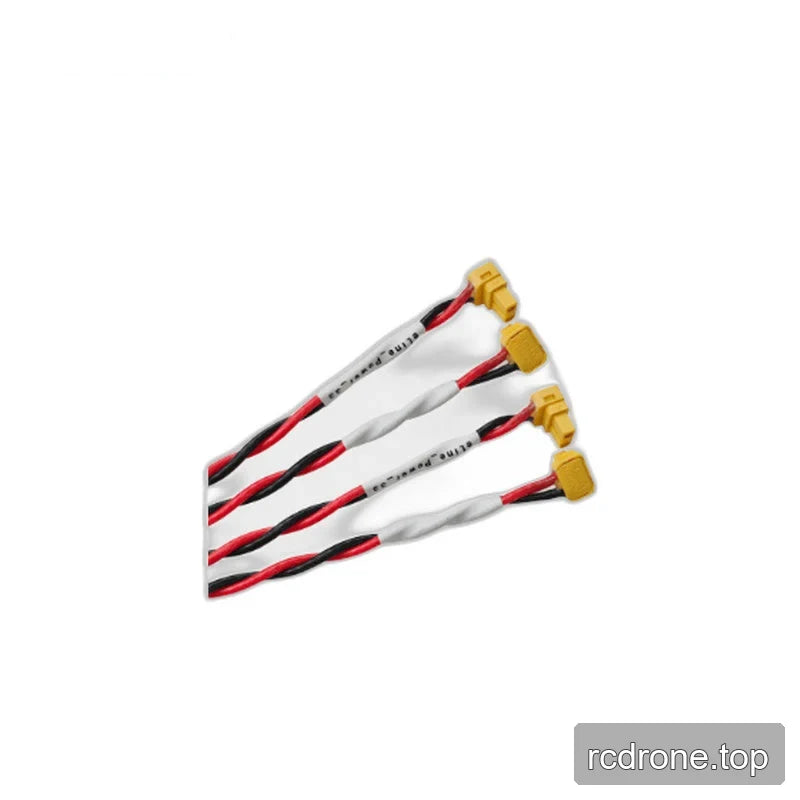 Several red-and-black cable leads with yellow connectors arranged diagonally on a white background