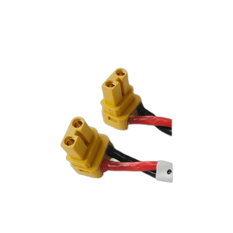 Close view of the ZeroErr eRob cable's paired yellow connectors with red and black leads
