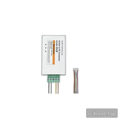 Silver eRob-eCoder to PC connector shown upright with green screw terminal, wire leads, and separate ribbon cable.